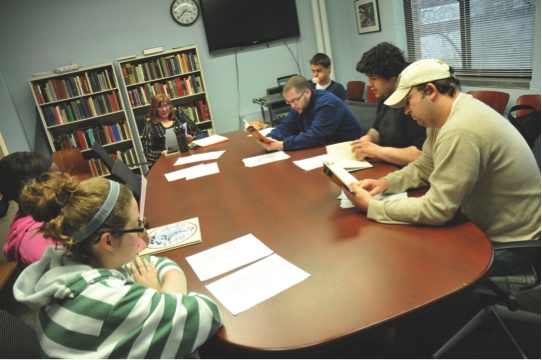An instructor facilitates group learning in a college classroom Courtesy of Western Michigan University
